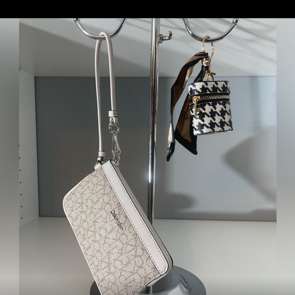 Calvin Klein Handbags - NWT Calvin Klein wristlet plus bag tag